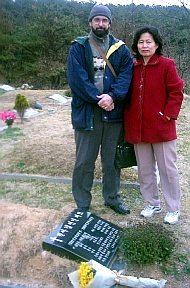 Ken Street & his wife Nansook in South Korea beside the graves of her parents.